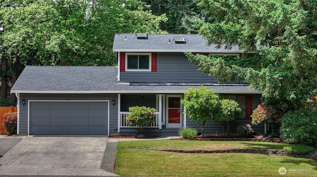 16420 92nd Avenue Ct E, Puyallup, WA 98375 - traditional-style home featuring driveway, a garage, a front yard, roof with shingles, and covered porch