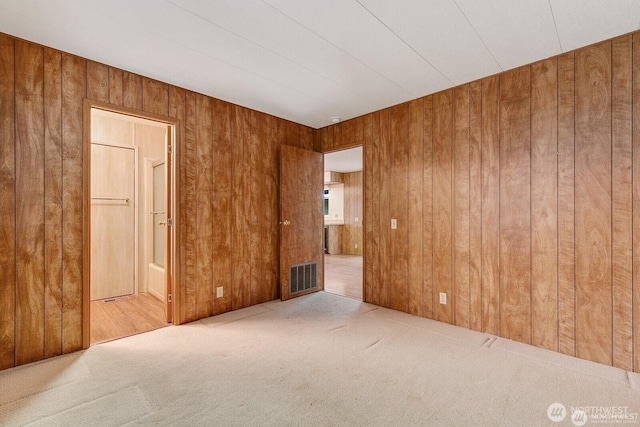 1415 84th St SE Unit 192, Everett, WA 98208 - carpeted empty room featuring wood walls