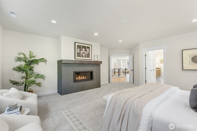 1806 154th Ave SE, Bellevue, WA 98007 - bedroom with light carpet, a tiled fireplace, recessed lighting, and ensuite bath