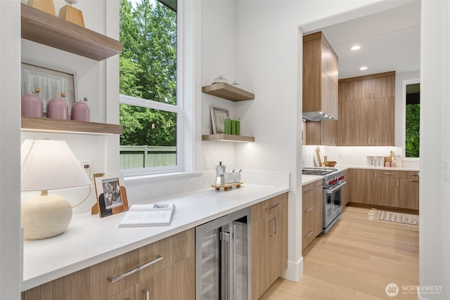 1806 154th Ave SE, Bellevue, WA 98007 - kitchen with open shelves, high end stainless steel range oven, beverage cooler, healthy amount of natural light, and recessed lighting