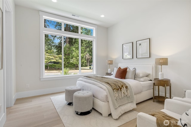 1806 154th Ave SE, Bellevue, WA 98007 - bedroom with multiple windows, light wood-style flooring, and recessed lighting