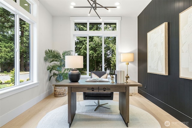 1806 154th Ave SE, Bellevue, WA 98007 - office with light wood-style floors, a chandelier, wood walls, and recessed lighting