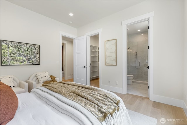 1806 154th Ave SE, Bellevue, WA 98007 - bedroom featuring light wood-type flooring, a walk in closet, recessed lighting, ensuite bath, and a closet
