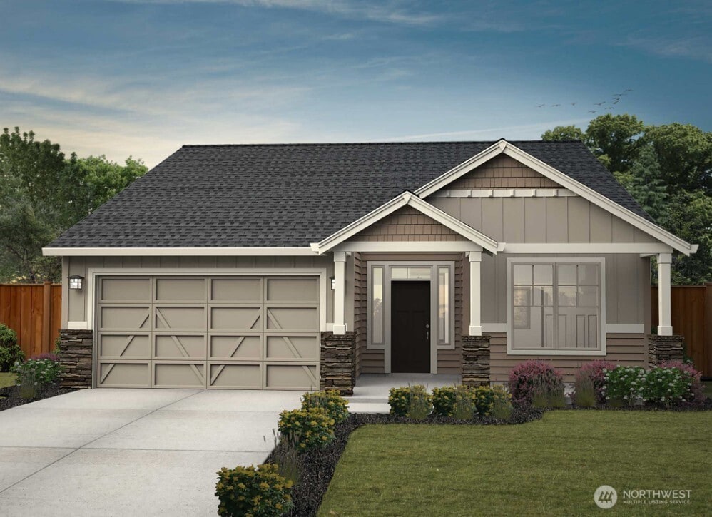 970 Rw Fletcher St, Winlock, WA 98596 - craftsman house with an attached garage, concrete driveway, stone siding, and a shingled roof