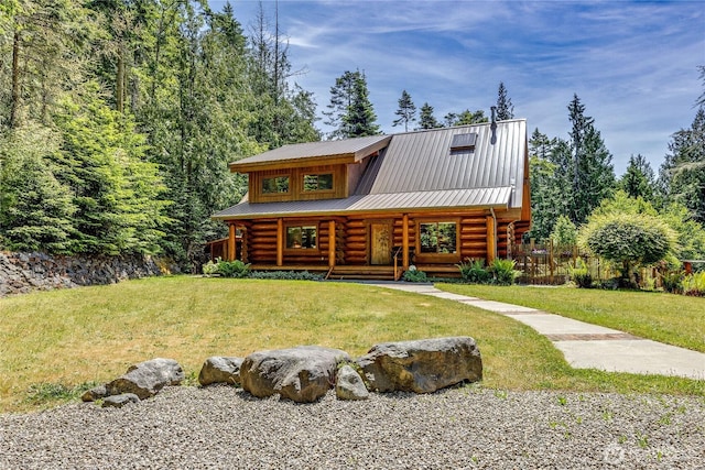 194 Protection Ridge Dr, Port Townsend, WA 98368 - log-style house featuring log exterior, covered porch, and a front lawn