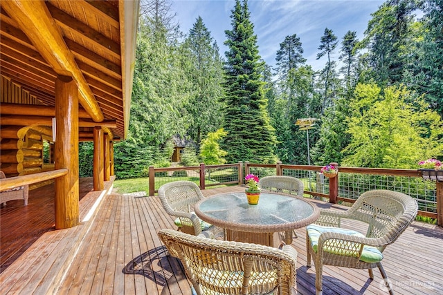 194 Protection Ridge Dr, Port Townsend, WA 98368 - wooden deck with outdoor dining area and view of scattered trees