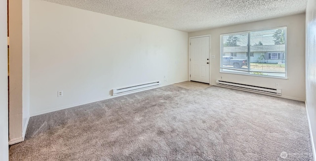 1700317009 16th Ave E, Spanaway, WA 98387 - unfurnished room featuring a baseboard radiator, carpet floors, and a textured ceiling