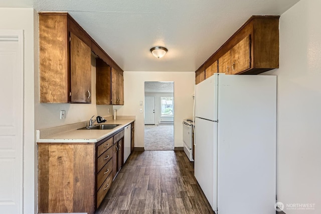 1700317009 16th Ave E, Spanaway, WA 98387 - kitchen with white appliances, dark wood-type flooring, and light countertops