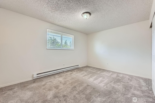 1700317009 16th Ave E, Spanaway, WA 98387 - empty room featuring baseboard heating, carpet floors, and a textured ceiling