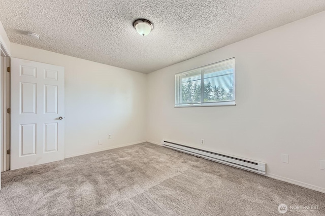 1700317009 16th Ave E, Spanaway, WA 98387 - carpeted empty room with a baseboard radiator, a textured ceiling, and a smoke detector