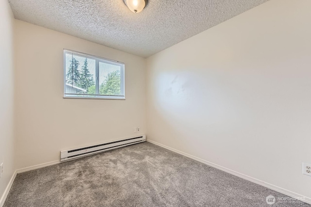 1700317009 16th Ave E, Spanaway, WA 98387 - carpeted empty room with baseboard heating and a textured ceiling