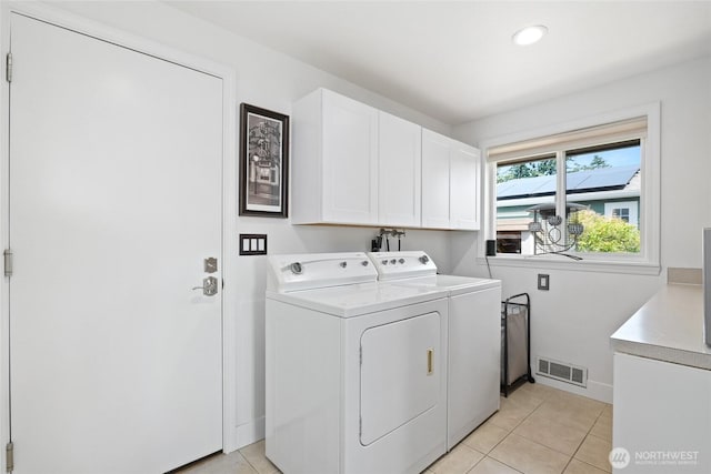 153 Swinomish Dr, La Conner, WA 98257 - washroom featuring cabinet space, separate washer and dryer, light tile patterned floors, and recessed lighting
