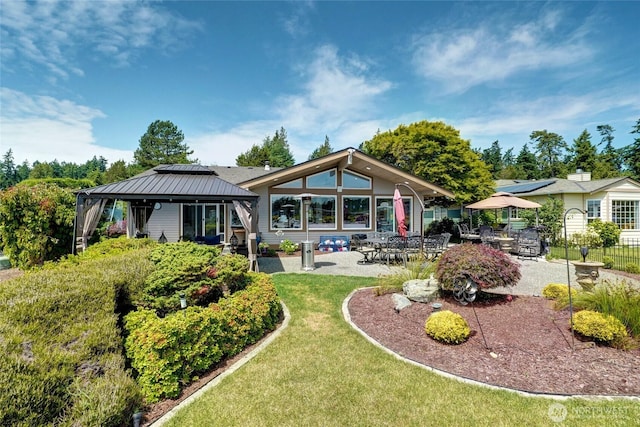 153 Swinomish Dr, La Conner, WA 98257 - back of property with a gazebo, a patio area, and a lawn