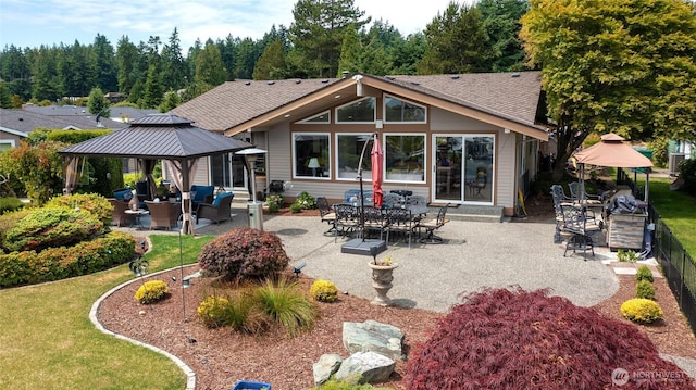 153 Swinomish Dr, La Conner, WA 98257 - back of house featuring a gazebo, a patio area, a shingled roof, and a yard