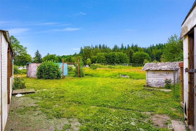 8739 F And S Grade Rd, Sedro Woolley, WA 98284 - view of yard with a forest view and an outbuilding