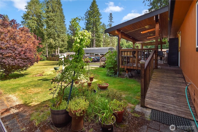 8031 Fir Tree Ln, Lake Stevens, WA 98258 - view of grassy yard with a wooden deck