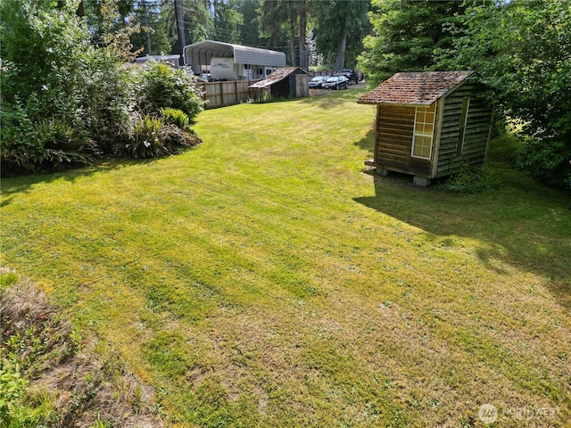 8031 Fir Tree Ln, Lake Stevens, WA 98258 - view of yard featuring a carport and a storage unit