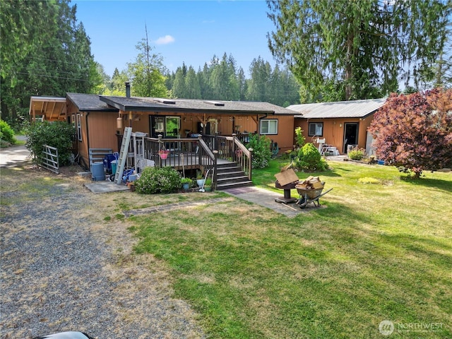 8031 Fir Tree Ln, Lake Stevens, WA 98258 - view of front of house featuring a wooden deck and a front lawn
