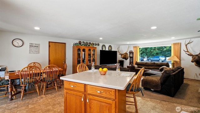 1314 S Division St, Walla Walla, WA 99362 - kitchen featuring a breakfast bar area, open floor plan, recessed lighting, light countertops, and a center island