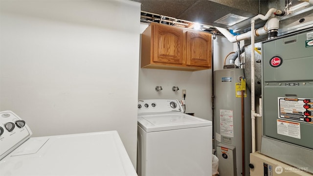 1314 S Division St, Walla Walla, WA 99362 - laundry room featuring gas water heater, washer and clothes dryer, cabinet space, and heating unit