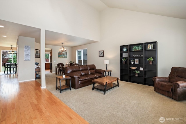 12115 184th Ave E, Bonney Lake, WA 98391 - living area with a chandelier, wood finished floors, and high vaulted ceiling