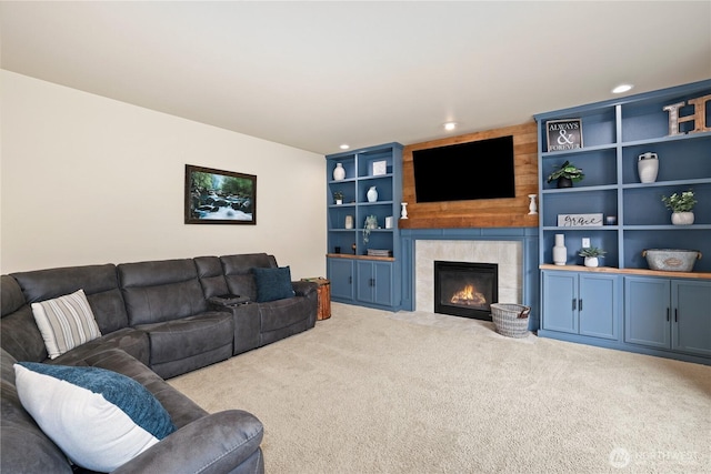 12115 184th Ave E, Bonney Lake, WA 98391 - carpeted living area featuring a tiled fireplace, built in features, and recessed lighting