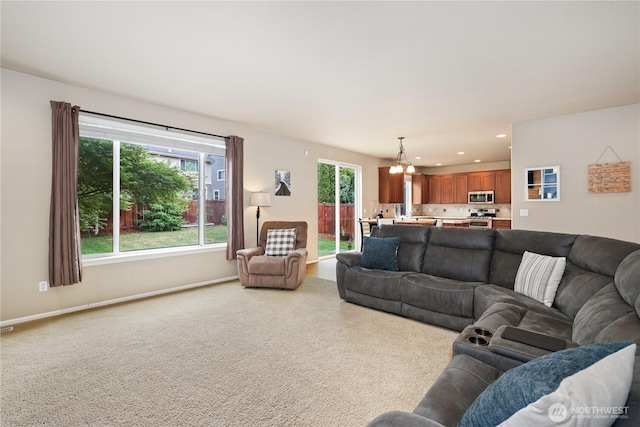 12115 184th Ave E, Bonney Lake, WA 98391 - living area with recessed lighting, light carpet, and a chandelier