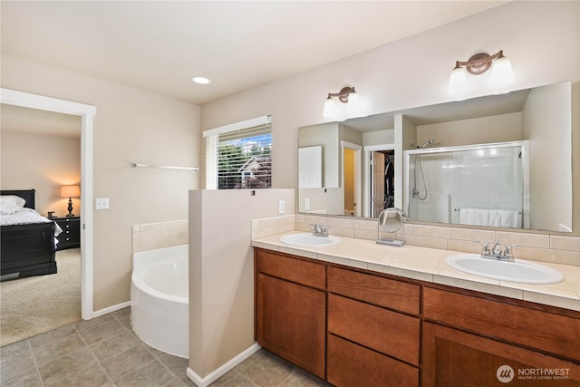 12115 184th Ave E, Bonney Lake, WA 98391 - full bath featuring ensuite bath, a bath, a shower stall, and double vanity