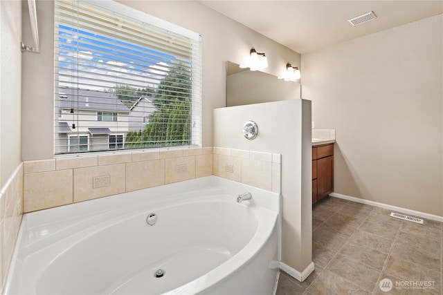 12115 184th Ave E, Bonney Lake, WA 98391 - full bathroom featuring vanity, a bath, and tile patterned flooring