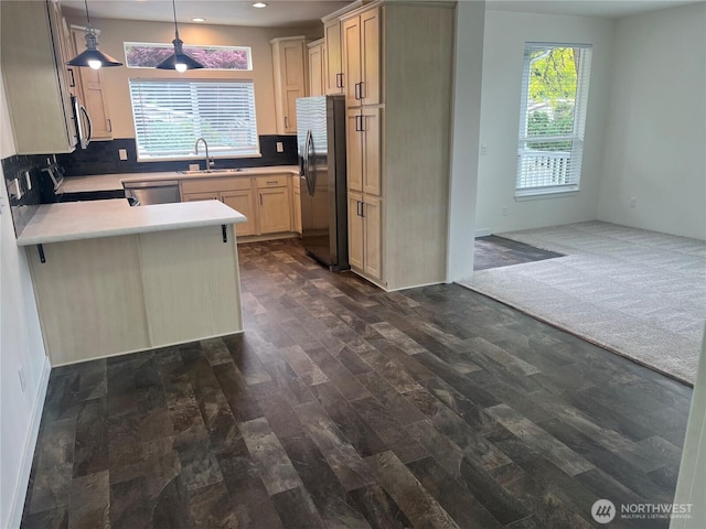 375 Union Ave SE Unit 97, Renton, WA 98059 - kitchen featuring appliances with stainless steel finishes, a peninsula, backsplash, recessed lighting, and open floor plan