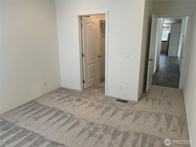 375 Union Ave SE Unit 97, Renton, WA 98059 - unfurnished bedroom with carpet floors and a walk in closet