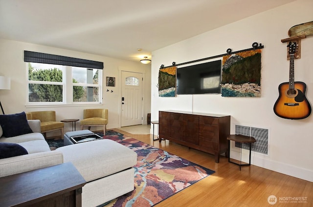 4876 Breezefair Rd, Freeland, WA 98249 - living area featuring wood finished floors and baseboards