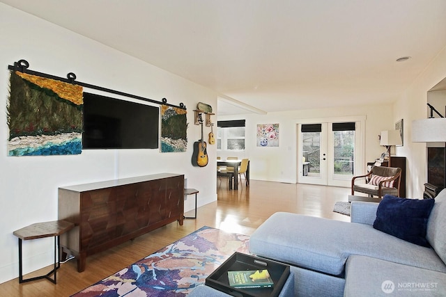 4876 Breezefair Rd, Freeland, WA 98249 - living area with french doors and wood finished floors