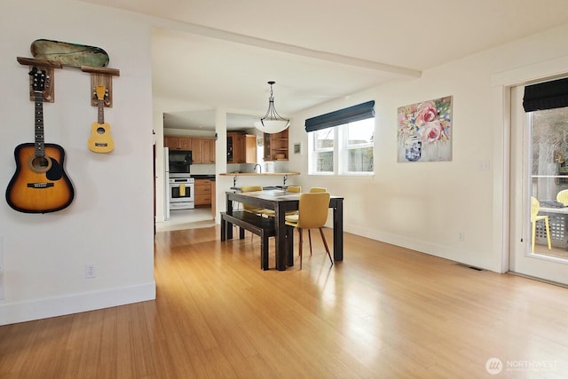 4876 Breezefair Rd, Freeland, WA 98249 - dining space with baseboards and light wood-type flooring