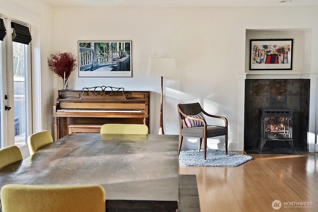 4876 Breezefair Rd, Freeland, WA 98249 - sitting room with wood finished floors and a wood stove