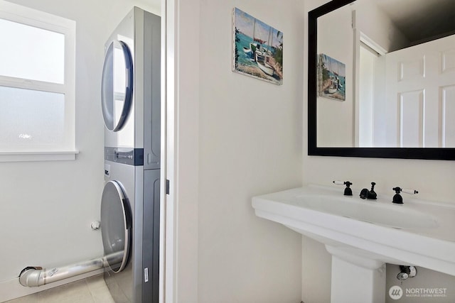 4876 Breezefair Rd, Freeland, WA 98249 - bathroom with estacked washer and dryer and tile patterned floors