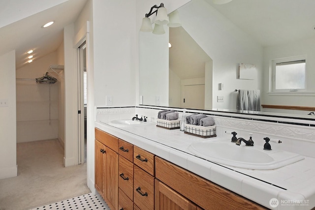 4876 Breezefair Rd, Freeland, WA 98249 - full bathroom with vaulted ceiling, double vanity, a spacious closet, and recessed lighting