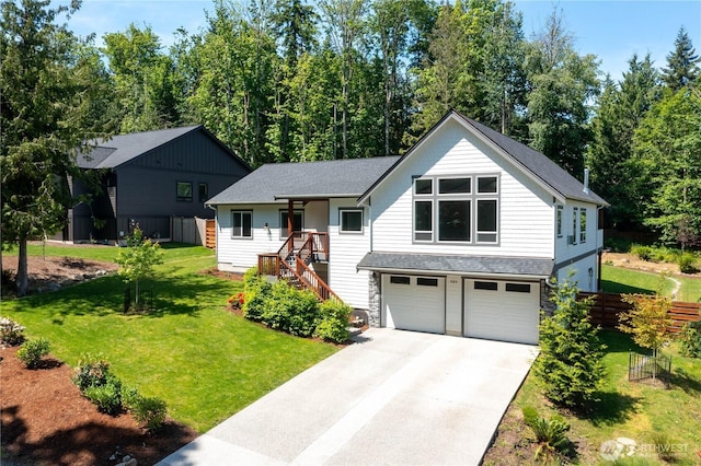 989 Lakewood Ln, Bellingham, WA 98229 - view of front of property with a garage, concrete driveway, and roof with shingles