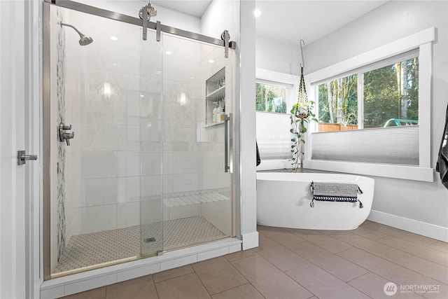 989 Lakewood Ln, Bellingham, WA 98229 - bathroom with a shower stall, a freestanding bath, and tile patterned flooring