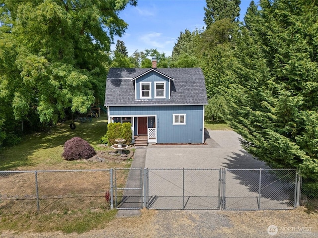 9413 356th Street Ct S, Roy, WA 98558 - view of front of house featuring a gate, a chimney, and roof with shingles