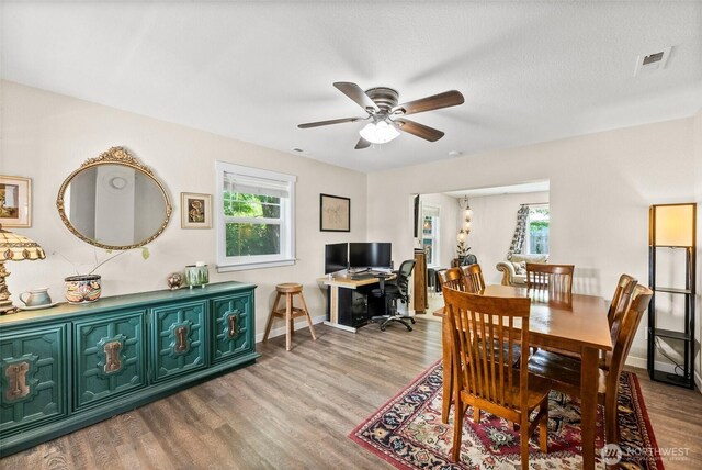 9413 356th Street Ct S, Roy, WA 98558 - dining room with wood finished floors, plenty of natural light, and ceiling fan