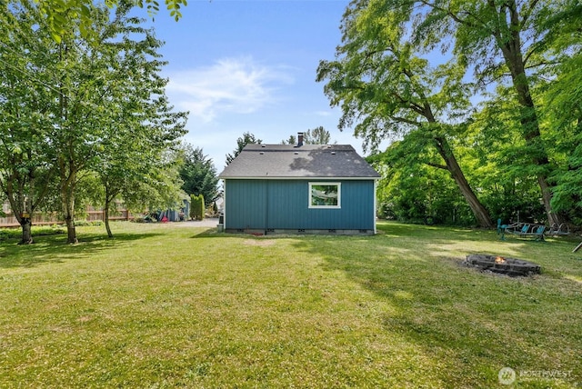 9413 356th Street Ct S, Roy, WA 98558 - view of green lawn featuring a fire pit