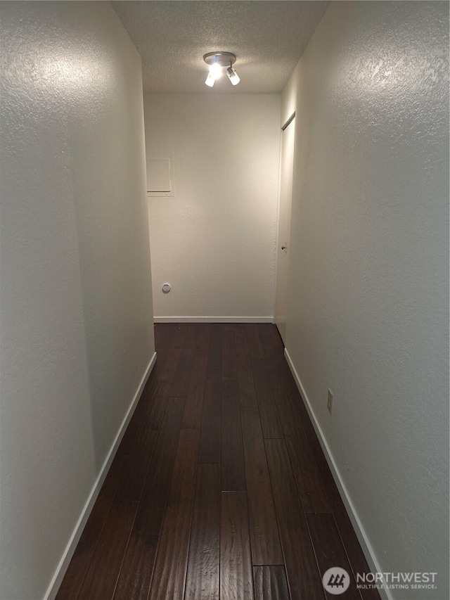 12840 SE 40th Ct Unit B12, Bellevue, WA 98006 - hallway with dark wood finished floors and a textured ceiling
