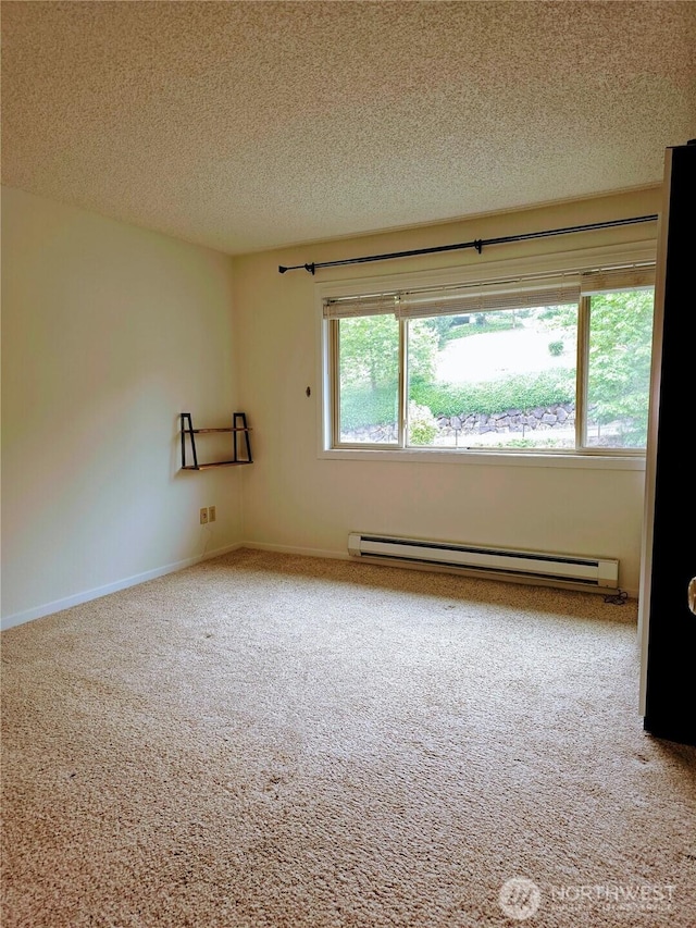 12840 SE 40th Ct Unit B12, Bellevue, WA 98006 - carpeted spare room featuring a baseboard radiator and a textured ceiling