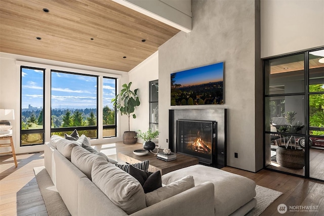 9001 NE 14th St, Clyde Hill, WA 98004 - living room with a fireplace, high vaulted ceiling, wood finished floors, and wood ceiling