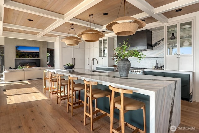 9001 NE 14th St, Clyde Hill, WA 98004 - kitchen with coffered ceiling, decorative backsplash, hardwood / wood-style floors, beam ceiling, and glass insert cabinets