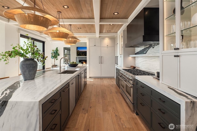 9001 NE 14th St, Clyde Hill, WA 98004 - kitchen featuring double oven range, wall chimney range hood, light wood-style floors, recessed lighting, and a wood ceiling with exposed beams