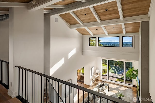 9001 NE 14th St, Clyde Hill, WA 98004 - stairs with high vaulted ceiling, a wooden ceiling with exposed beams, and wood finished floors