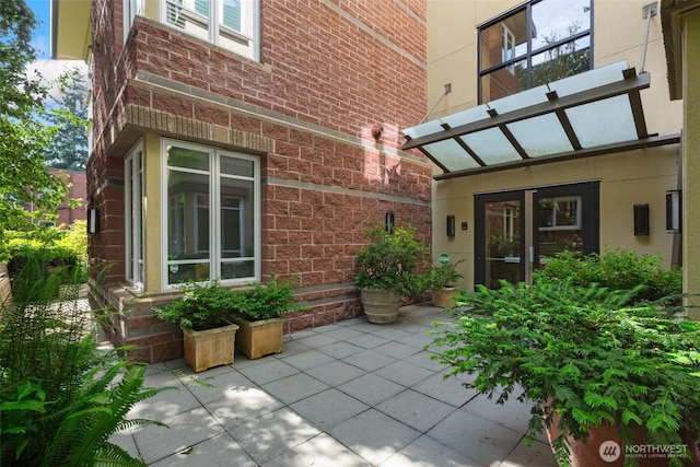 719 2nd Ave W Unit 101, Seattle, WA 98119 - entrance to property with brick siding and a patio area