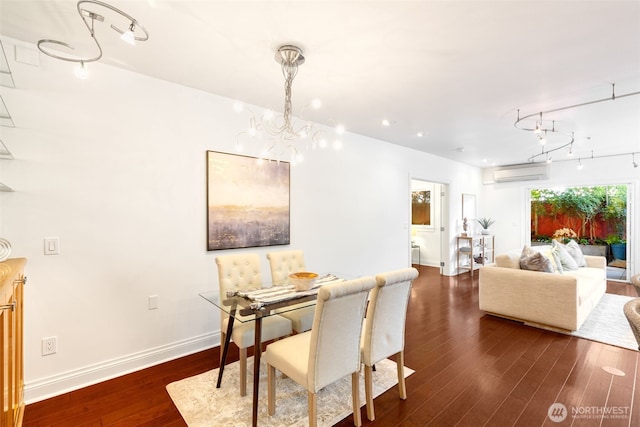 719 2nd Ave W Unit 101, Seattle, WA 98119 - dining area featuring dark wood-style floors, a wall unit AC, and a chandelier